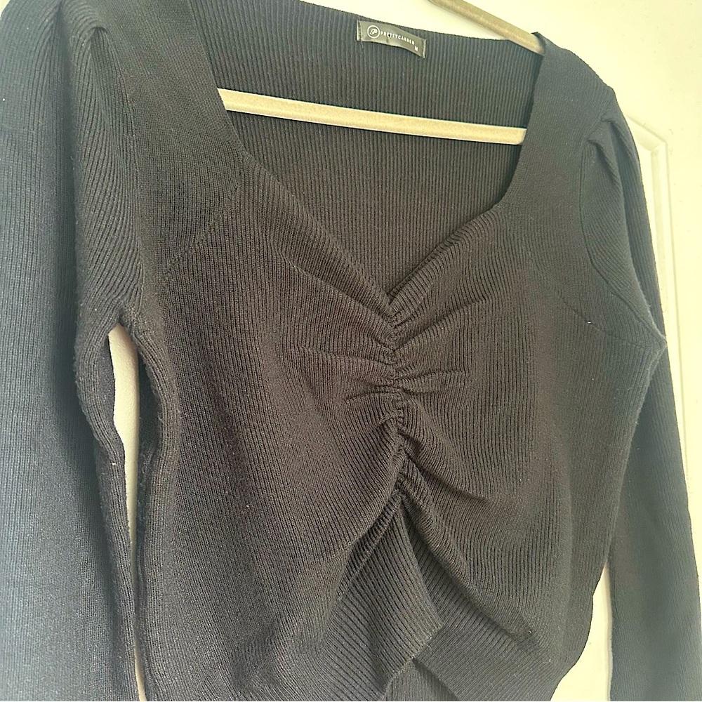 Pretty Garden black sweater with scrunched seams around bust. Size M.